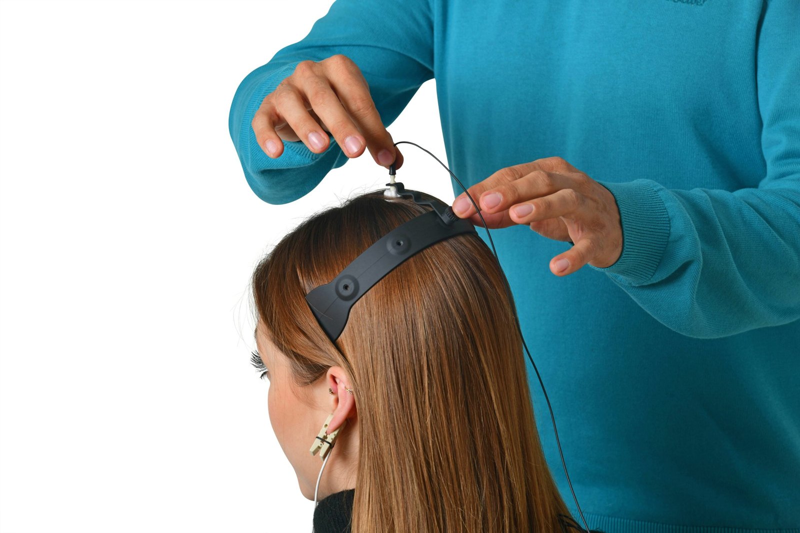 a woman getting her hair cut by a hair stylist